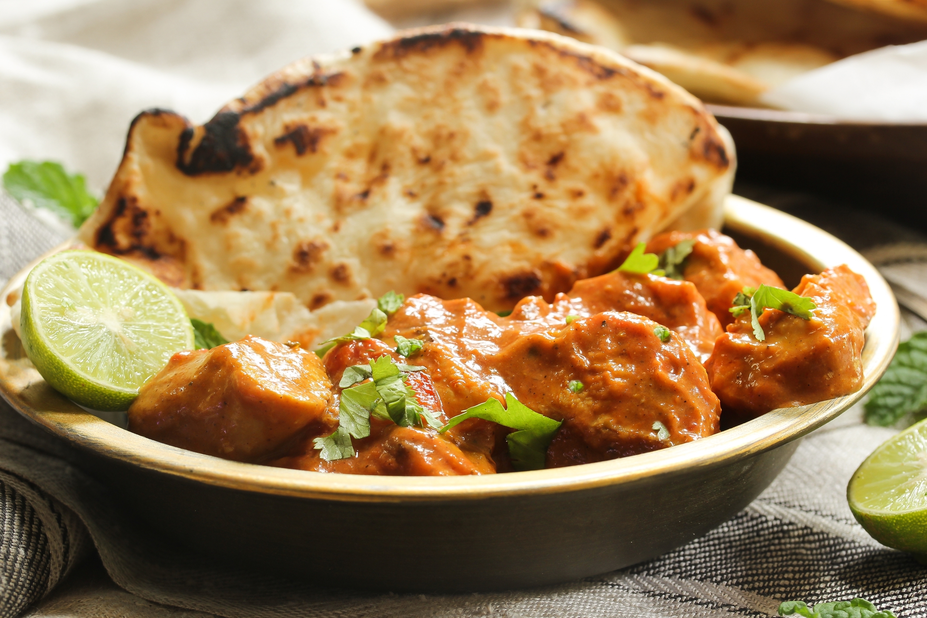 chicken tikka masala dinner on black background