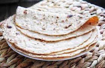  a few chapatti on a plate