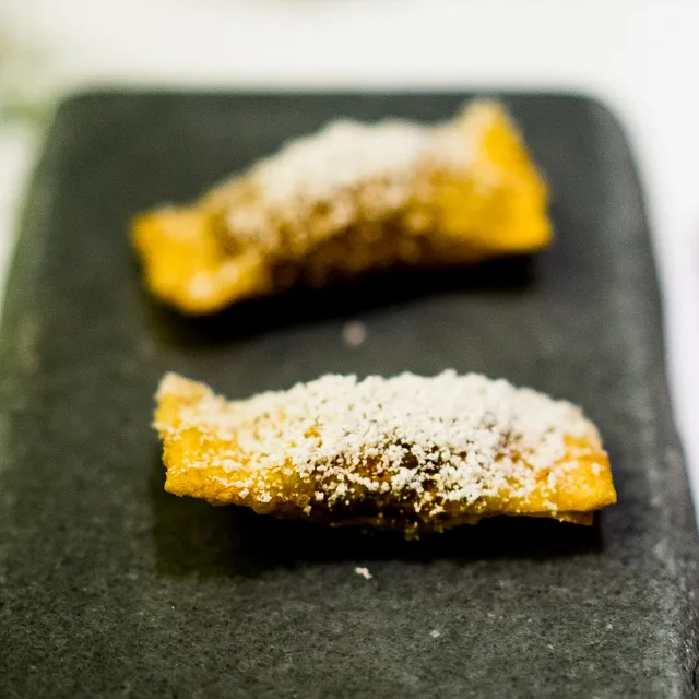 tube shaped samosas dusted with powder